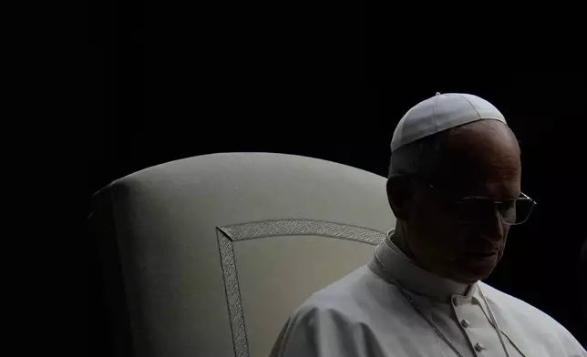 FILE - Pope Leo XIV presides over a Rosary vigil for peace in St. Peter's Square on the 63rd anniversary of the start of the Second Vatican Council, at the Vatican, Oct. 12, 2025. (AP Photo/Gregorio Borgia, File)
