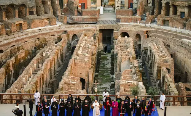 FILE - Pope Leo XIV attends an inter-religious meeting to pray for peace inside the Colosseum in Rome, Oct. 28, 2025. (AP Photo/Gregorio Borgia, File)
