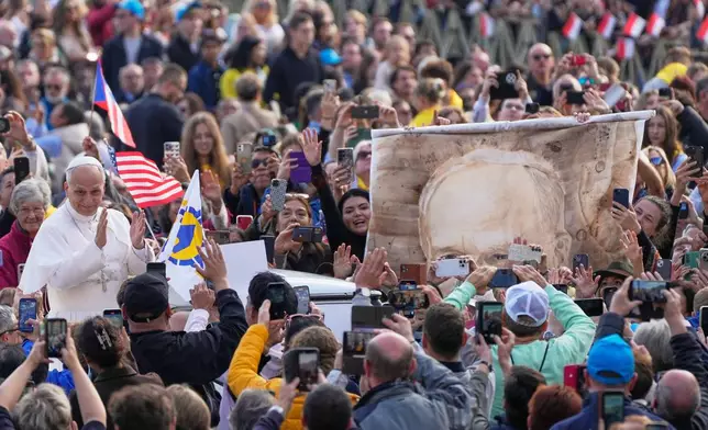 FILE - Pope Leo XIV greets faithful during the weekly general audience in St. Peter's Square, at the Vatican, Oct. 29, 2025. (AP Photo/Gregorio Borgia, File)