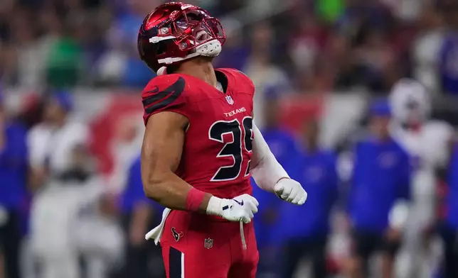 Houston Texans linebacker Henry To'oTo'o celebrates after sacking Buffalo Bills' Josh Allen in the second half of an NFL football game Thursday, Nov. 20, 2025, in Houston. (AP Photo/Eric Christian Smith)