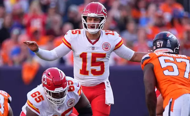 Kansas City Chiefs quarterback Patrick Mahomes (15) calls a play during the first half an NFL football game against the Denver Broncos Sunday, Nov. 16, 2025, in Denver. (AP Photo/David Zalubowski)