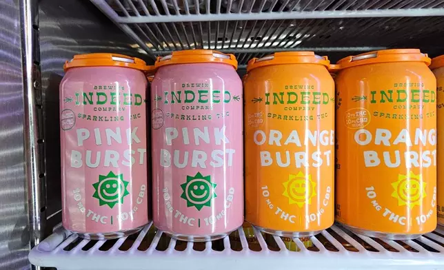 Cans of seltzer containing THC, the active ingredient in marijuana, are shown in a cooler at the Indeed Brewery taproom in Minneapolis on Thursday, Nov. 20, 2025. (AP Photo/Steve Karnowski)
