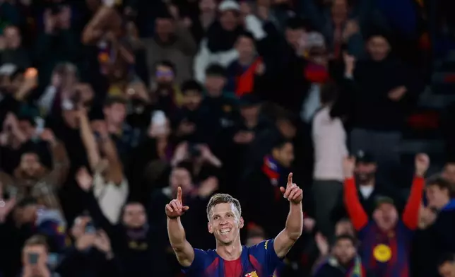 Barcelona's Dani Olmo celebrates after scoring his side's third goal during a Spanish La Liga soccer match between Barcelona and Alaves, in Barcelona, Spain, Saturday, Nov. 29, 2025. (AP Photo/Joan Monfort)