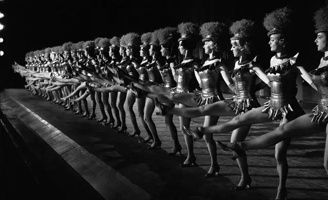 FILE - The 36 Rockettes go through a dance number as they rehearse for their Christmas show at Radio City Music Hall in New York in December 1963. (AP Photo/Dan Grossi, File)