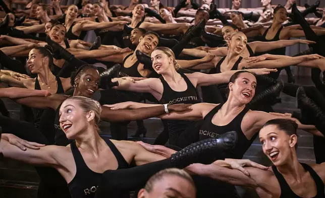 FILE - Rockettes rehearse for the 2023 Radio City Music Hall Christmas Spectacular, at St. Paul the Apostle Church, Oct. 19, 2023, in New York. (AP Photo/Andres Kudacki, File)