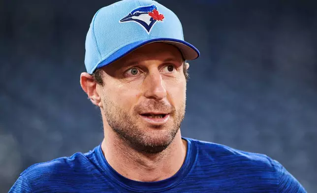 Toronto Blue Jays' Max Scherzer (31) looks on before batting practice Saturday, Oct. 18, 2025, in Toronto, ahead of Sunday's Game 6 in baseball's American League Championship Series against the Seattle Mariners. (Sammy Kogan/The Canadian Press via AP)