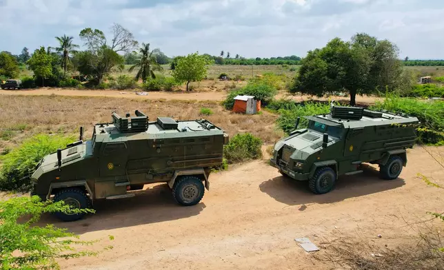 Armored personnel carriers (APCs) belonging to the Somalia National Army move on a road in Sabiid Canole, Somalia, Tuesday, Nov. 11, 2025. (AP Photo/Jackson Njehia)