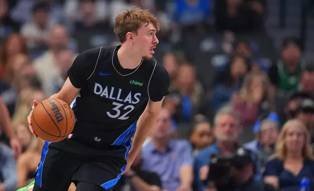 Dallas Mavericks forward Cooper Flagg dribbles the ball against the Portland Trail Blazers during the first half of an NBA basketball game Sunday, Nov. 16, 2025, in Dallas. (AP Photo/Julio Cortez)