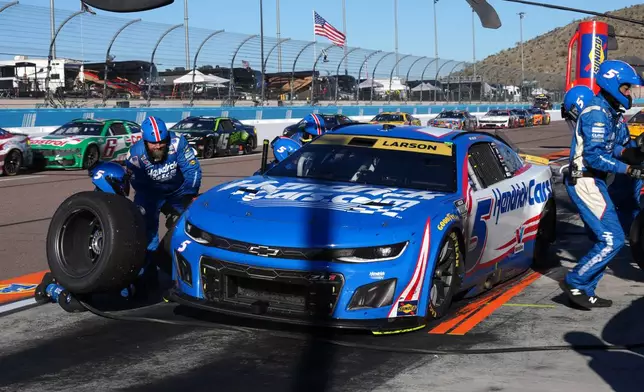 Kyle Larson pits during a NASCAR Cup Series auto race Sunday, Nov. 2, 2025, in Avondale, Ariz. (AP Photo/Rick Scuteri)