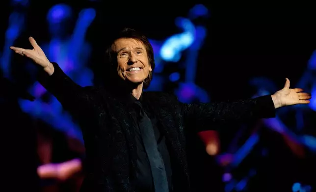 FILE - Singer Miguel Rafael Martos Sánchez of Spain, better known as Raphael, performs at the Royal Theatre in Madrid, Spain on July 22, 2015. (AP Photo/Abraham Caro Marin, File)