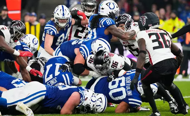 Indianapolis Colts defense stops Atlanta Falcons defensive end Zach Harrison (96) during an NFL football game, Sunday, Nov. 9, 2025, in Berlin, Germany. (AP Photo/Martin Meissner)