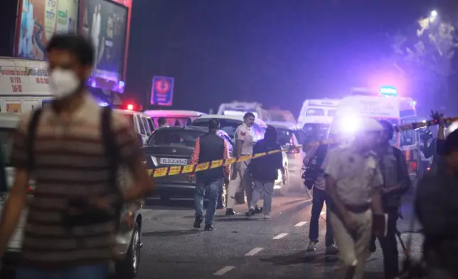 Policemen secure the site after a car explosion near the historic Red Fort in New Delhi, India, Monday, Nov. 10, 2025. (AP Photo)