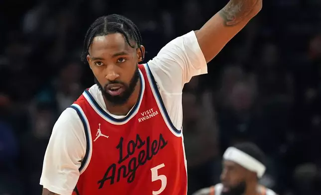 Los Angeles Clippers forward Derrick Jones Jr. celebrates a made 3-pointer against the Phoenix Suns during the first half of an NBA basketball game Thursday, Nov. 6, 2025, in Phoenix. (AP Photo/Ross D. Franklin)
