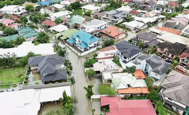 Residential areas are flooded by Typhoon Kalmaegi as it affects Cebu city, central Philippines, Tuesday Nov. 4, 2025. (AP Photo/Jacqueline Hernandez)