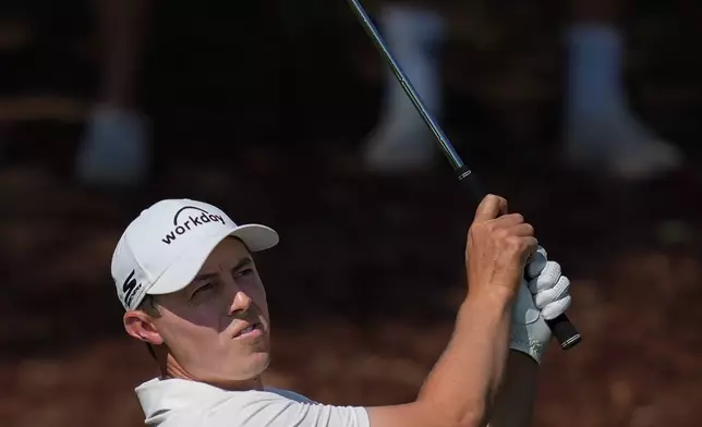 Matt Fitzpatrick of England watches his shot from the 5th fairway during the final round of World Tour Golf Championship in Dubai, United Arab Emirates, Sunday, Nov. 16, 2025. (AP Photo/Altaf Qadri)
