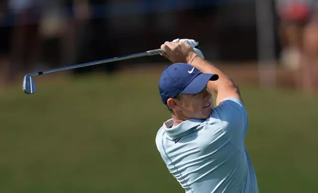 Rory McIlroy of Northern Ireland plays his second shot on the 9th hole during the final round of World Tour Golf Championship in Dubai, United Arab Emirates, Sunday, Nov. 16, 2025. (AP Photo/Altaf Qadri)