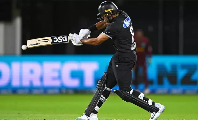 New Zealand's Rachin Ravindra bats against the West Indies during their One Day International cricket match in Napier, New Zealand, Wednesday Nov. 19, 2025. (Kerry Marshall/Photosport via AP)