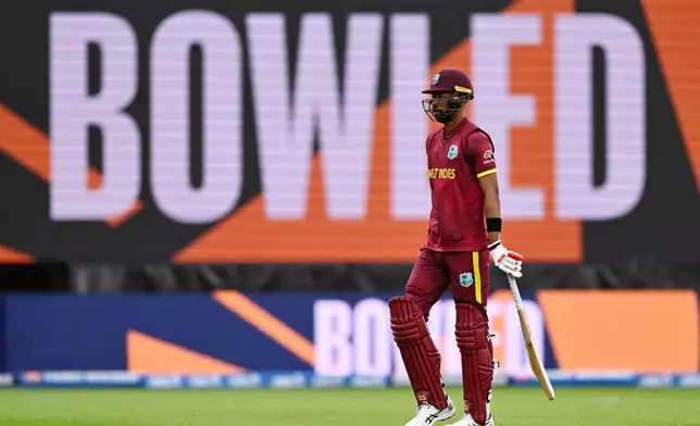 West Indies' Roston Chase walks off after he is bowled by New Zealand's Nathan Smith during their One Day International cricket match in Napier, New Zealand, Wednesday Nov. 19, 2025. (Kerry Marshall/Photosport via AP)