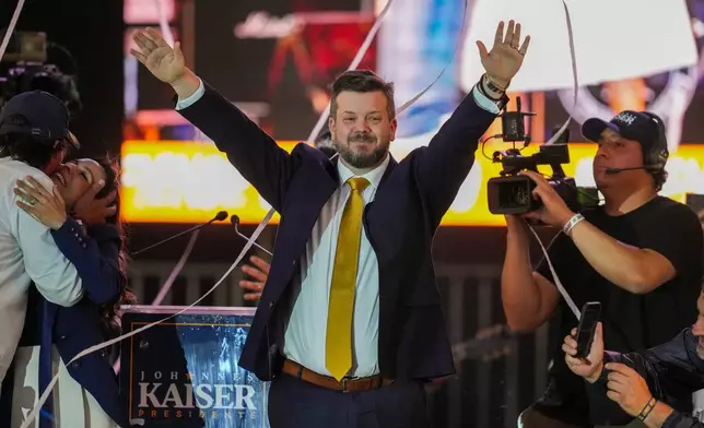 Presidential candidate Johannes Kaiser of the National Libertarian Party gestures during a rally ahead of upcoming general elections, in Santiago, Chile, Wednesday, Nov. 12, 2025. (AP Photo/Esteban Felix)