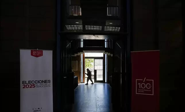 Soldier guard the old Mapocho train station, now a cultural center, that will be used as a polling station for the general election in Santiago, Chile, Friday, Nov. 14, 2025. (AP Photo/Esteban Felix)