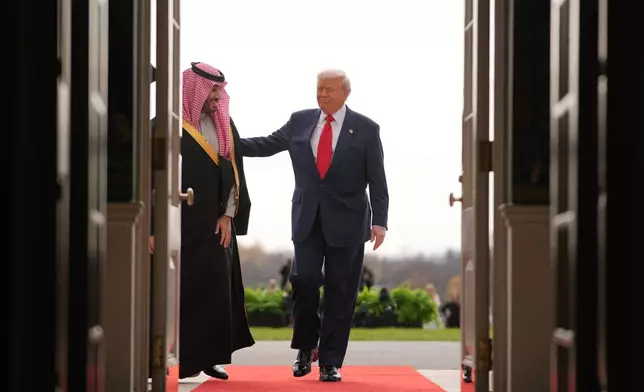 President Donald Trump welcomes Saudi Arabia's Crown Prince Mohammed bin Salman to the White House, Tuesday, Nov. 18, 2025, in Washington. (AP Photo/Evan Vucci)