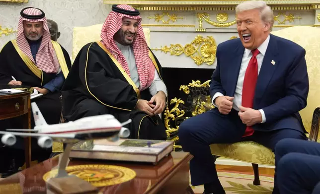 President Donald Trump meets Saudi Arabia's Crown Prince Mohammed bin Salman in the Oval Office of the White House, Tuesday, Nov. 18, 2025, in Washington. (AP Photo/Evan Vucci)