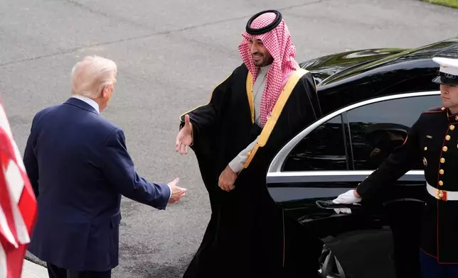 President Donald Trump welcomes Saudi Arabia's Crown Prince Mohammed bin Salman to the White House, Tuesday, Nov. 18, 2025, in Washington. (AP Photo/Alex Brandon)