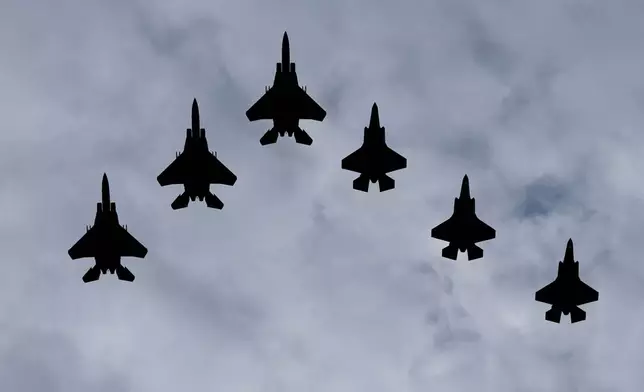 U.S. Air Force jets flyover downtown Washington as President Donald Trump host Saudi Arabia's Cronw Prince Mohammed bin Salman,Tuesday, Nov., 18, 2025. (AP Photo/Pablo Martinez Monsivais)