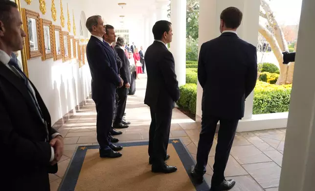 Vice President JD Vance, from right, Secretary of State Marco Rubio, Treasury Secretary Scott Bessent and Defense Secretary Pete Hegseth watch as President Donald Trump and Saudi Arabia's Crown Prince Mohammed bin Salman walk along the Colonnade to the Oval Office at the White House, Tuesday, Nov. 18, 2025, in Washington. (AP Photo/Evan Vucci)