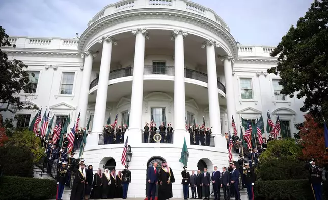 President Donald Trump welcomes Saudi Arabia's Crown Prince Mohammed bin Salman to the White House, Tuesday, Nov. 18, 2025, in Washington. (AP Photo/Mark Schiefelbein)