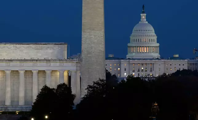The Lincoln Memorial, Washington Monument and the U.S. Capitol in Washington, Tuesday, Nov. 4, 2025. (AP Photo/John McDonnell)