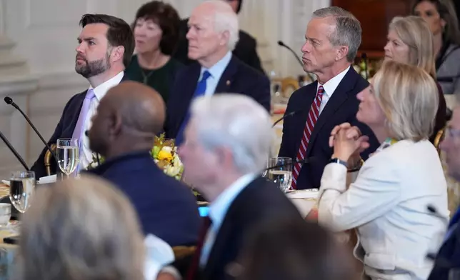 Senate Majority Leader John Thune, R-S.D., Vice President JD Vance and others, listen to President Donald Trump speak as they attend a breakfast with other Republicans in the State Dining Room of the White House, Wednesday, Nov. 5, 2025, in Washington. (AP Photo/Evan Vucci)
