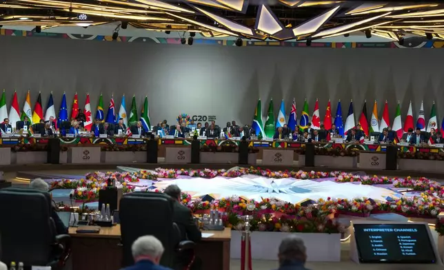South African President Cyril Ramaphosa addresses the opening session of the G20 leaders' summit in Johannesburg, South Africa, Saturday, Nov. 22, 2025. (AP Photo/Misper Apawu,Pool)