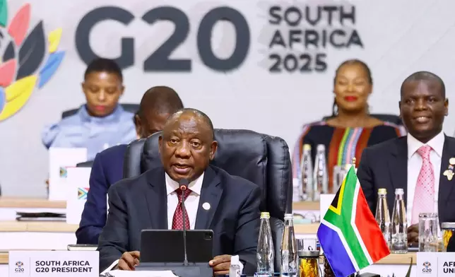 South African President Cyril Ramaphos aaddresses the opening session of the G20 leaders' summit, in Johannesburg, South Africa, Saturday, Nov. 22, 2025. (Thomas Mukoya/Pool Photo via AP)