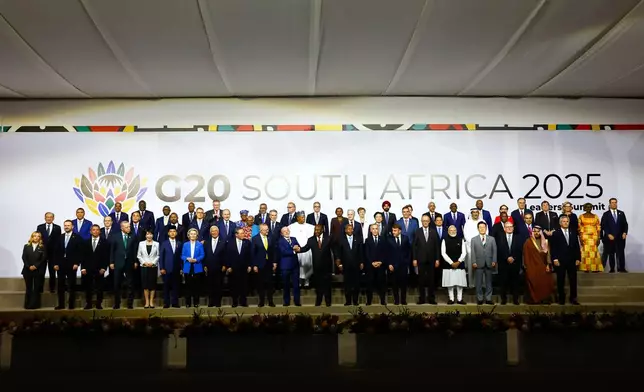 Leaders and delegates pose for a group photo, on the opening day of the G20 Leaders' Summit, in Johannesburg, South Africa, Saturday, Nov. 22, 2025. (Thomas Mukoya/Pool Photo via AP)