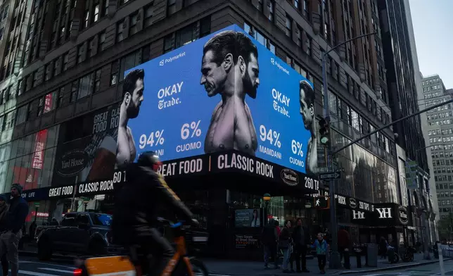 Advertisements by the American company Polymarket predict a victory for Zohran Mamdani in the New York City mayoral election on Tuesday, Nov. 4, 2025, in New York. (AP Photo/Olga Fedorova)