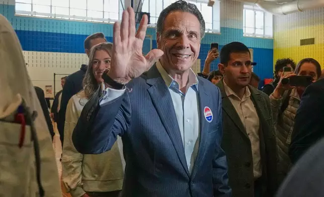 New York mayoral candidate Andrew Cuomo waves after voting in New York, Tuesday, Nov. 4, 2025. (AP Photo/Richard Drew)