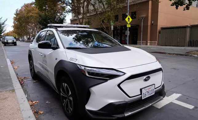 This City of San Jose parking enforcement vehicle is one of two equipped with a small detection camera that can detect road hazards and potholes, in San Jose, Calif., Wednesday, Nov. 12, 2025. (AP Photo/Godofredo A. Vásquez)