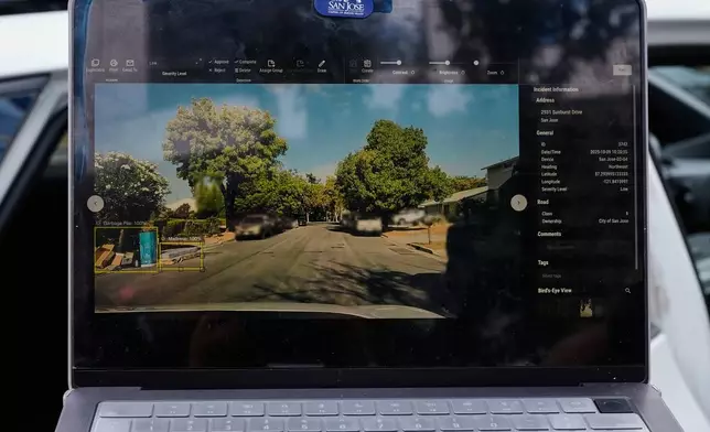 Chelsea Palacio, public information manager for the City of San Jose, showcases how a small detection camera uses AI to detect road hazards and potholes in San Jose, Calif., Wednesday, Nov. 12, 2025. (AP Photo/Godofredo A. Vásquez)