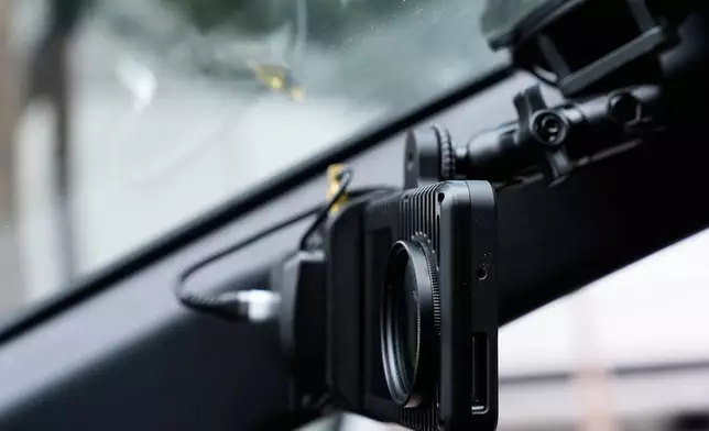 A small detection camera – which uses AI to detect road hazards and potholes – is seen mounted inside a parking enforcement vehicle, in San Jose, Calif., Wednesday, Nov. 12, 2025. (AP Photo/Godofredo A. Vásquez)