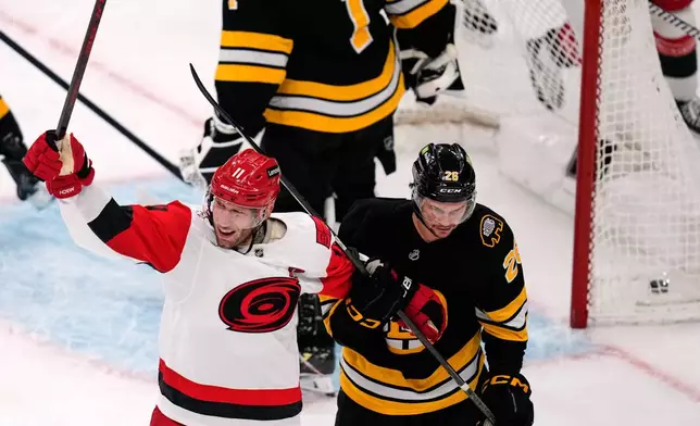 Carolina Hurricanes center Jordan Staal celebrates after his goal against Boston Bruins goaltender Jeremy Swayman during the second period of an NHL hockey game, Monday, Nov. 17, 2025, in Boston. (AP Photo/Charles Krupa)