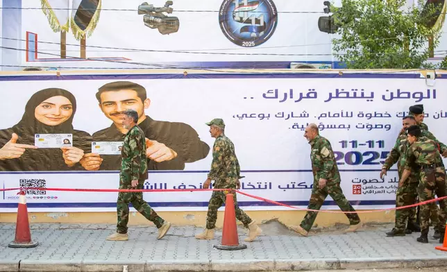Members of the Popular Mobilization Forces gather to vote during a special voting session ahead of Tuesday's parliamentary election in Najaf, Iraq, Sunday, Nov. 9, 2025. (AP Photo/Anmar Khalil)