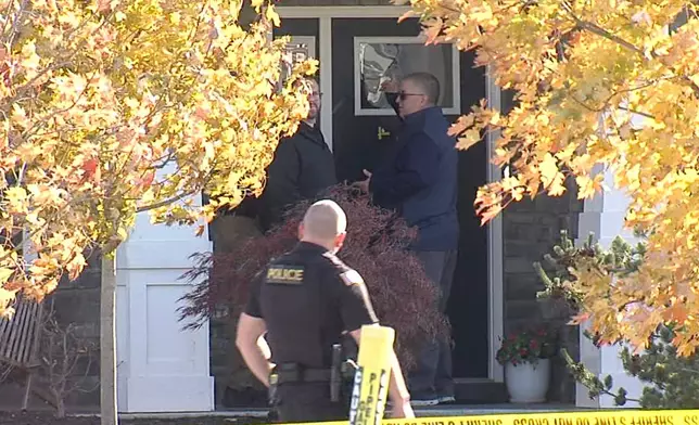 CORRECTS LAST NAME - In this image from video provided by WRTV, investigators work at the site of the fatal shooting of house cleaner Maria Florinda Rios Perez who went to the wrong address in Whitestown, Ind., on Wednesday, Nov. 5, 2025. (WRTV via AP)