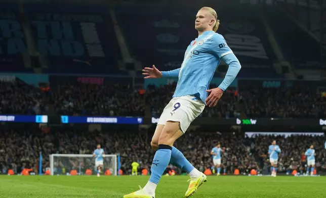 Manchester City's Erling Haaland celebrates after scoring his side's opening goal during the English Premier League soccer match between Manchester City and Bournemouth in Manchester, England, Sunday, Nov. 2, 2025. (AP Photo/Ian Hodgson)