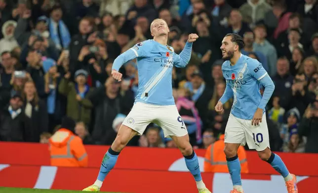 Manchester City's Erling Haaland celebrates after scoring his side's second goal during the English Premier League soccer match between Manchester City and Bournemouth in Manchester, England, Sunday, Nov. 2, 2025. (AP Photo/Ian Hodgson)