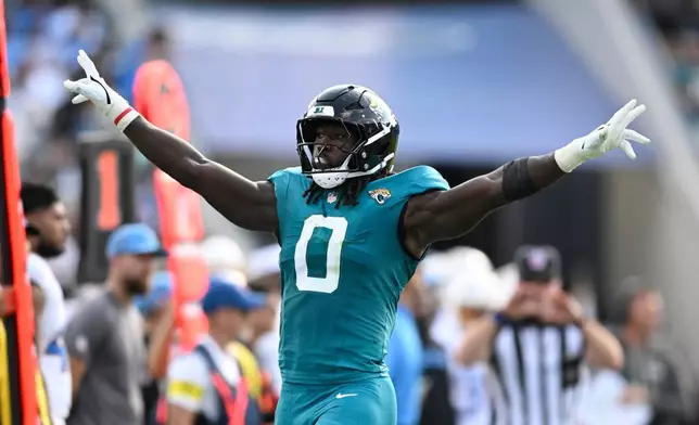 Jacksonville Jaguars' Devin Lloyd reacts during the first half of an NFL football game against the Los Angeles Chargers, Sunday, Nov. 16, 2025, in Jacksonville, Fla. (AP Photo/Phelan M. Ebenhack)