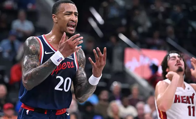 Los Angeles Clippers forward John Collins (20) argues with a referee after fouling a player from the Miami Heat during the first half of an NBA basketball game, Monday, Nov. 3, 2025, in Los Angeles. (AP Photo/Wally Skalij)
