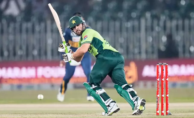 Pakistan's Salman Ali Agha plays a shot during the first one day international cricket match between Pakistan and Sri Lanka, in Rawalpindi, Pakistan, Tuesday, Nov. 11, 2025. (AP Photo/Anjum Naveed)