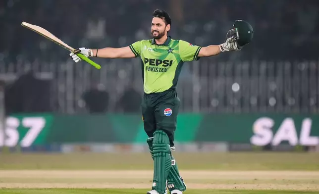 Pakistan's Salman Ali Agha celebrates after scoring century during the first one day international cricket match between Pakistan and Sri Lanka, in Rawalpindi, Pakistan, Tuesday, Nov. 11, 2025. (AP Photo/Anjum Naveed)