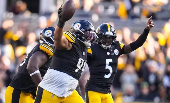 Pittsburgh Steelers defensive tackle Derrick Harmon (99) celebrates a fumble recovery against the Indianapolis Colts during the second half of an NFL football game in Pittsburgh, Sunday, Nov. 2, 2025. (AP Photo/Gene J. Puskar)